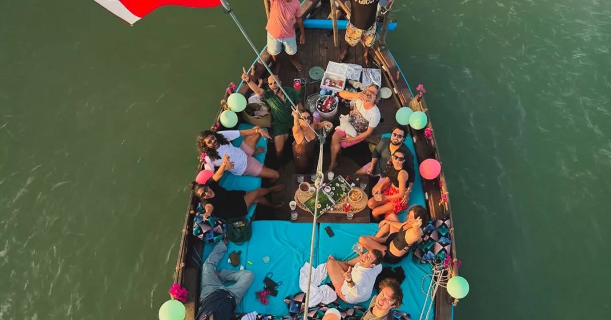 A traditional dhow sailing the Kilifi creek at sunset